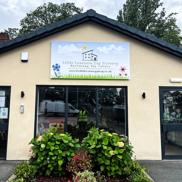 An image of the exterior signage for The Little Learners Day Nursery.